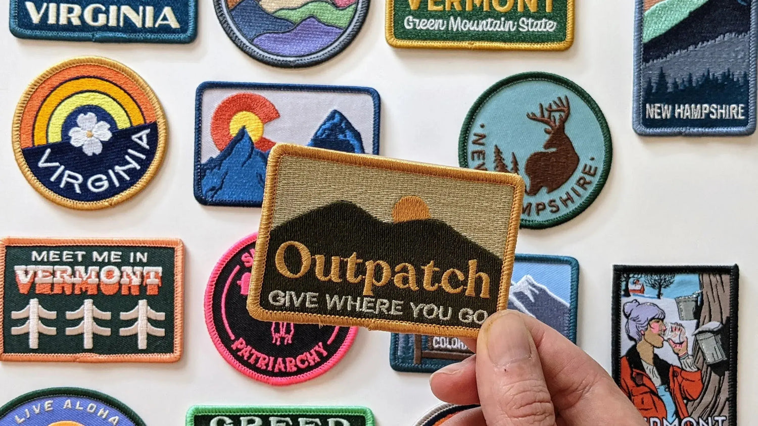 Embracing-Stick-On-Embroidered-Patches-for-Corporate-Branding EarthHero Corporate Gifting and Custom Swag