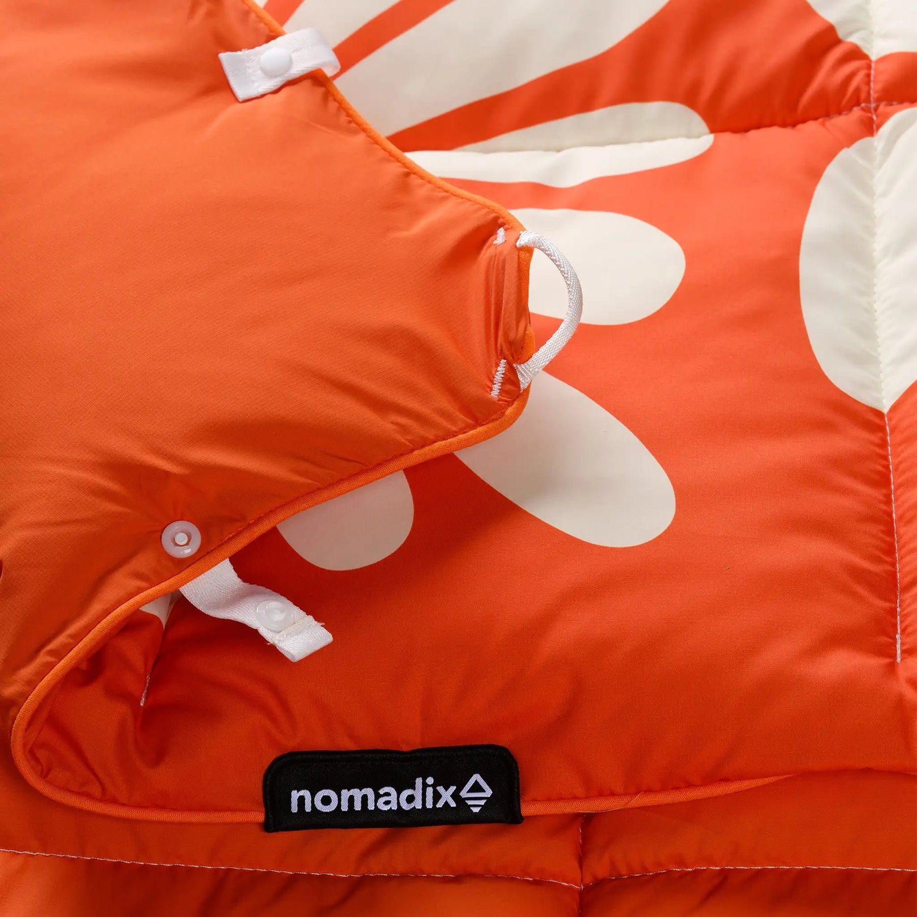 Graphene Puffer Blanket: Big Flowers Expedition Orange Nomadix